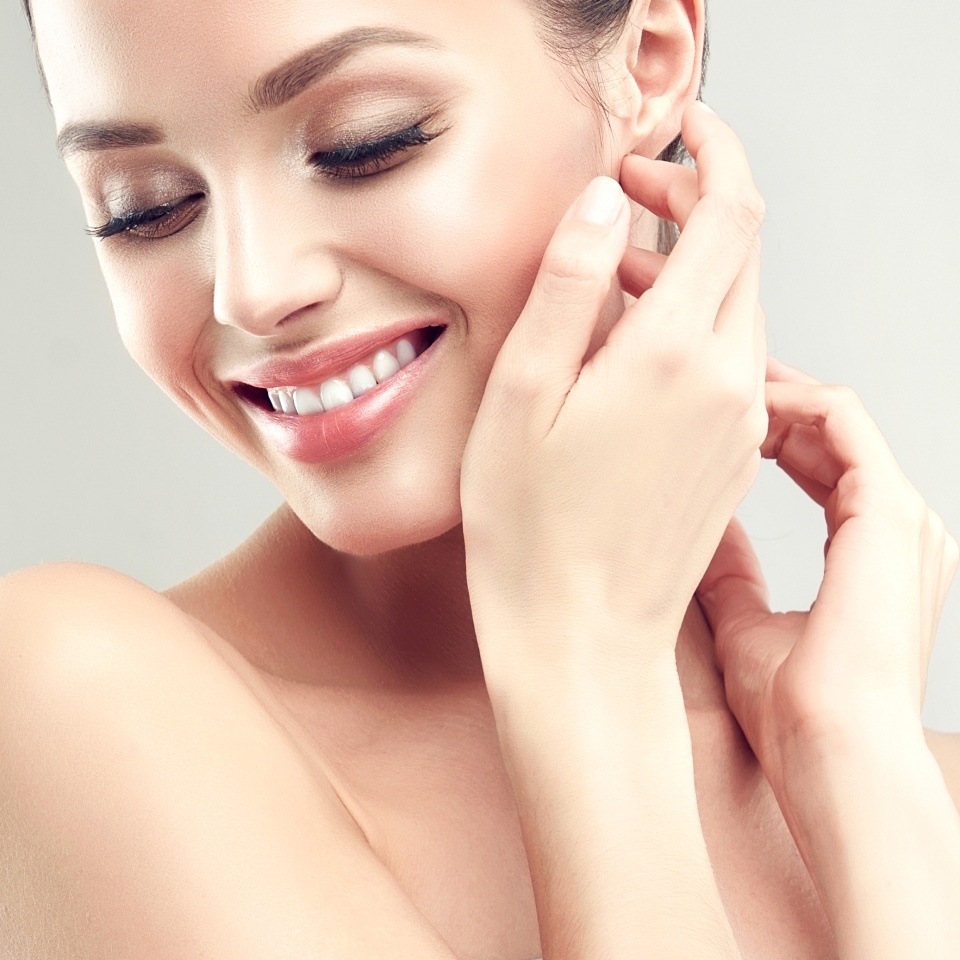 Beautiful young woman with clean fresh skin .Girl beauty face care. Facial treatment .