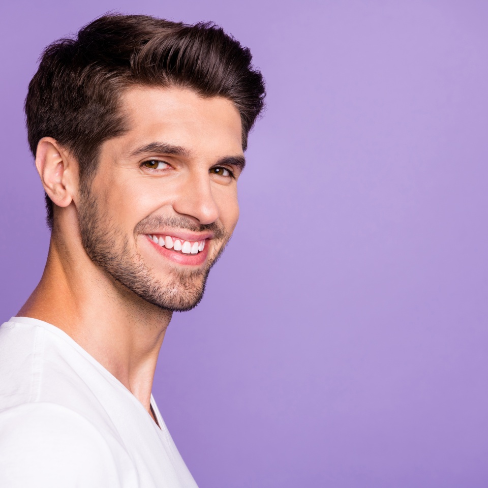 Close-up profile side view portrait of his he nice attractive content brown-haired cheerful cheery guy modern look isolated over bright vivid shine vibrant lilac violet purple color background