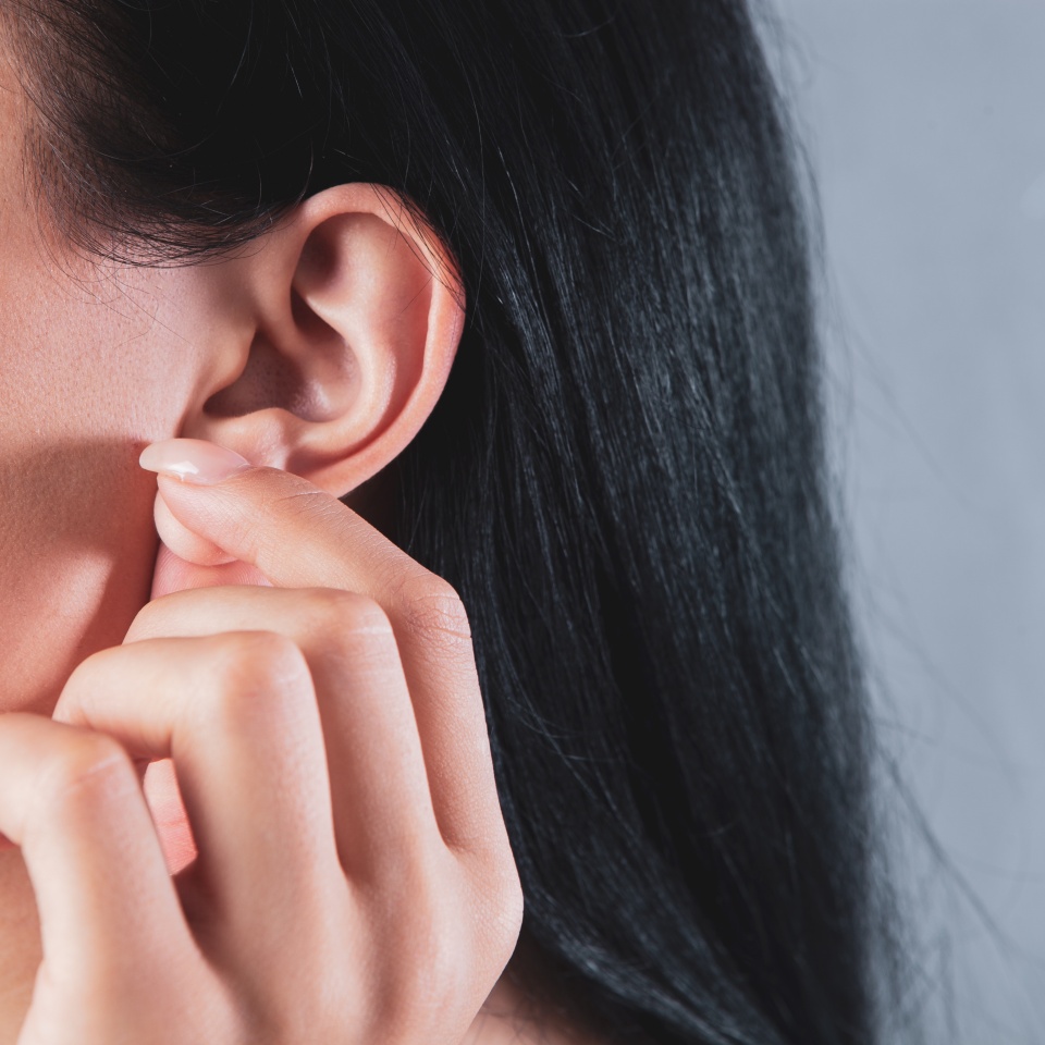 young girl holding a lobe