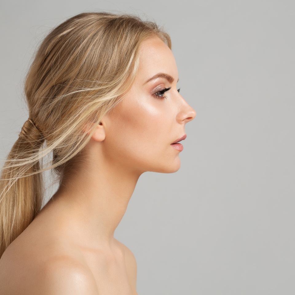 Woman Face Profile. Young Girl Portrait with Smooth healthy Skin. Model Facial Side View over Gray. Body and Neck Skin Care Cosmetology