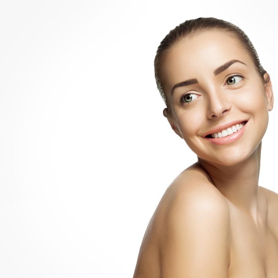 Portrait of beautiful smiling woman with pure healthy skin with natural make-up and white teeth