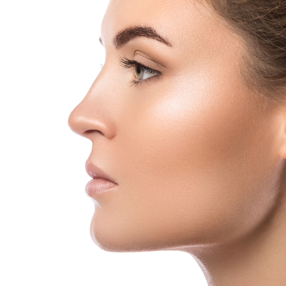 Female face in profile on white background